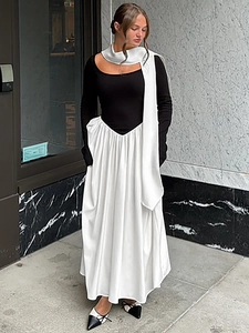 Women's two-piece black long sleeve top and white high waist maxi dress set