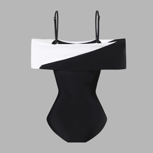 Detail of the elegant black and white patchwork V-neckline with adjustable thin straps