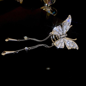 Close-up of butterfly hair claw with sparkling rhinestones and long tassel chains