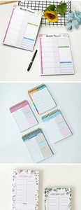Detailed view of floral spiral weekly planner notebooks with habits and meal sections