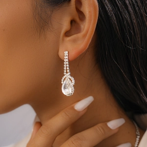 Close-up of a silver water drop pendant necklace with shimmering clear crystals