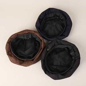 Detailed interior of denim berets showing high-quality stitching and sweatband lining