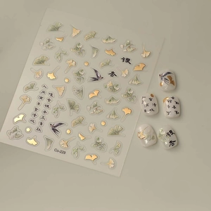 Detailed 5D nail art stickers with golden ginkgo leaves and Chinese calligraphy designs
