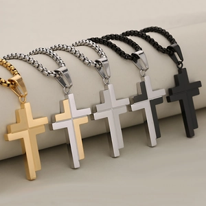 Minimalist stainless steel cross pendants in five colors on box chains displayed in a row