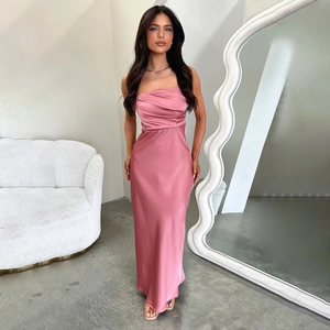 Detail of elegant pink satin tube dress with backless design and premium glossy finish