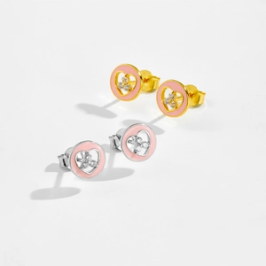 Close-up of S925 sterling silver heart earrings with pink enamel and clear gemstones