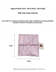Detailed size view of pink heart-quilted sanitary bag with snap button closure