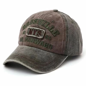 Detail view of washed denim baseball cap with vintage embroidery and adjustable strap
