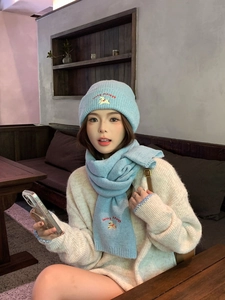 Detailed embroidery of dog motif and Lucky Piggery text on light blue knitted hat set