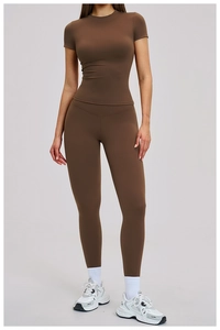 Detail of high-stretch quick-dry yoga set featuring brown slim-fit T-shirt and high-waist leggings