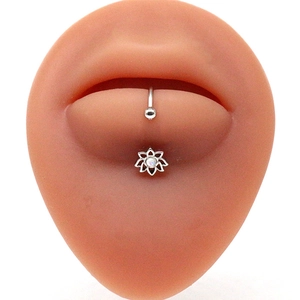 Silver stainless steel lotus lip stud with opal stone on a silicone lip model