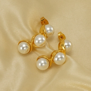 Elegant gold stainless steel S-curve earrings with three white pearls on champagne satin