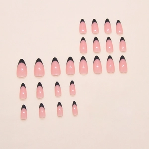 Classic French almond-shaped press-on nails in nude pink with elegant black tips