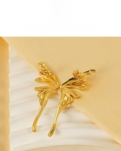 Detail of 18K gold-plated butterfly wing earrings on soft satin with butterfly backs