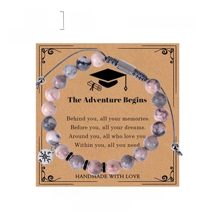 Pink zebra stone compass bracelet with 8mm beads on graduation gift card display