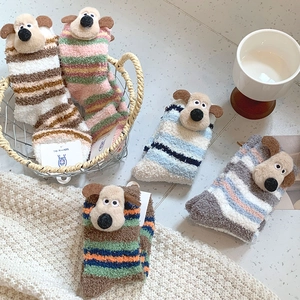 Detailed plush texture of coral fleece striped socks with 3D cartoon dog embroidery