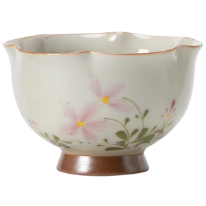 Handcrafted ceramic tea cup with daisy floral pattern and elegant wavy rim edge