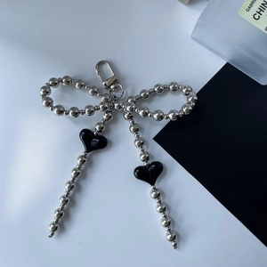 Silver bead bow keychain with black heart charms and spring clasp accessory