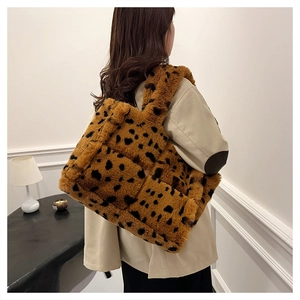 Furry leopard print tote bag in brown and black shown in a lifestyle indoor setting