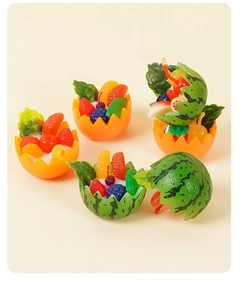 Detailed macro view of miniature resin fruit salad bowls featuring realistic berry textures