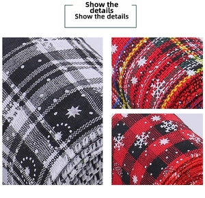 Close-up of rustic Christmas ribbons with classic plaid patterns and white snowflake prints