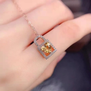 Exquisite rose gold heart lock necklace featuring a yellow crystal and pavé diamonds