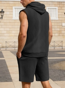 Rear view of men's sleeveless black sports hoodie and shorts with waffle texture