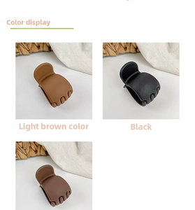 Close-up of matte plastic claw clips in coffee, black, and brown for high ponytail styles