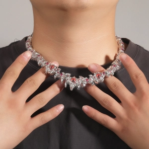 Hip hop silver thorn necklace featuring red eye rhinestones and spiky punk claw accents