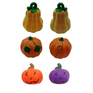 Set of 6 mini decorative Halloween pumpkins in orange and purple with spooky faces