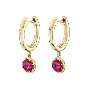 Macro detail of gold hoop earrings with multi-prong set round pink zircon crystals