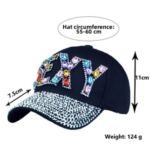 Detail view of denim baseball cap with rhinestone EXY design and size specifications