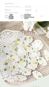 Close-up of 45 pieces vintage floral stickers in a box for DIY journal decoration