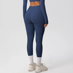 Detail view of navy high-waisted yoga pants with ergonomic stitching for lifting glutes