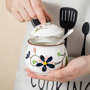 Hand-painted floral ceramic seasoning jar with lid and spoon for kitchen organization