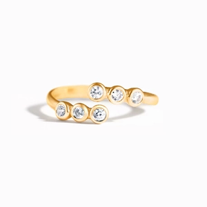 Elegant s925 sterling silver bypass ring with six bezel-set round cubic zirconia stones