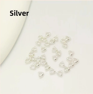 Close-up of silver-plated triangle spacer beads for DIY jewelry and necklaces