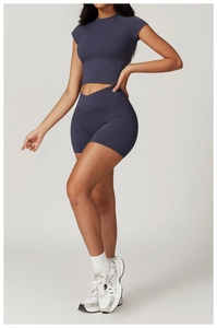 Detail of high-stretch dark grey-blue yoga set featuring a V-shaped crossover waistband