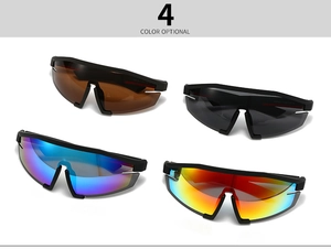 Detail view of four oversize retro sunglasses in dark brown, black, blue and red finishes