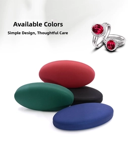 Detail showing high-grade oval leather jewelry boxes in burgundy, green, black and blue