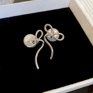 14K gold plated bow pearl stud earrings presented in a premium black velvet jewelry box