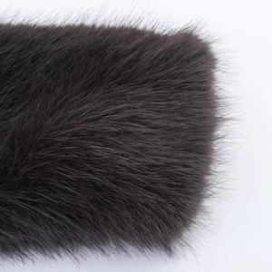 Close-up of deep charcoal grey faux fur texture with high-density long fibers