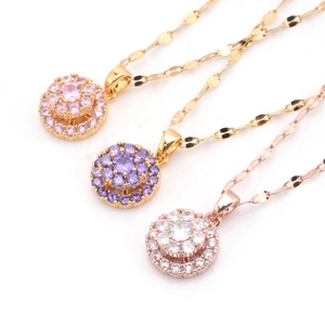 Rotating titanium steel pendant necklaces with cubic zirconia in gold and rose gold