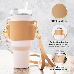 Detail view of beige leather sleeve for Stanley 40oz with pocket and gold hardware