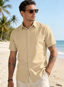 Detail of men's beige short sleeve button-down shirt with breathable linen texture