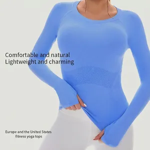 Women's light blue yoga long sleeve top with thumbholes and breathable mesh side panels