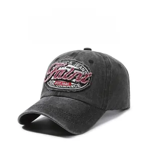 Detail of vintage washed charcoal cotton baseball cap featuring retro embroidered patch