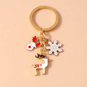 Christmas reindeer and snowflake keychain with gold finish and white enamel charms