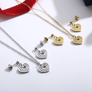 Golden and silver stainless steel jewelry sets with layered hollow heart necklaces and earrings