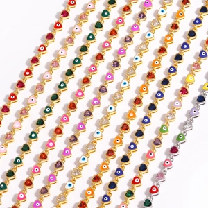 Colorful evil eye heart bracelets with enamel and stones in a diagonal gold and silver array